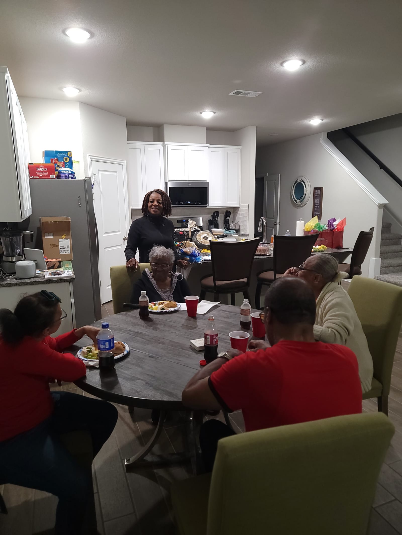 Seniors sharing lunch at a long table
