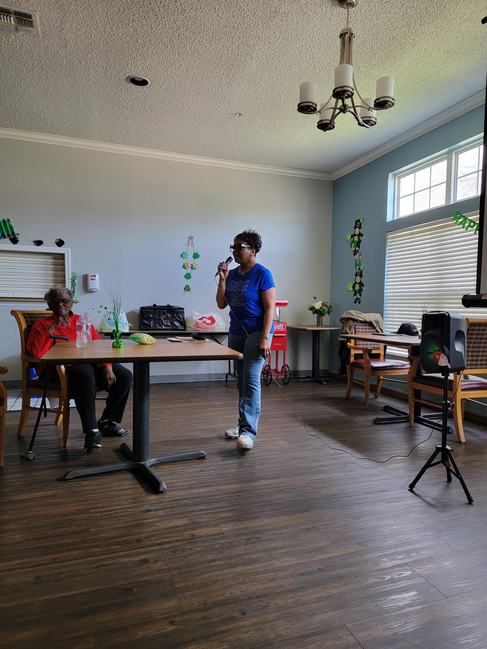 A volunteer setting up the room before bingo