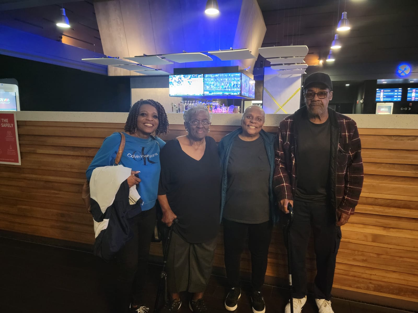 Four Silver Saints friends standing together at an event