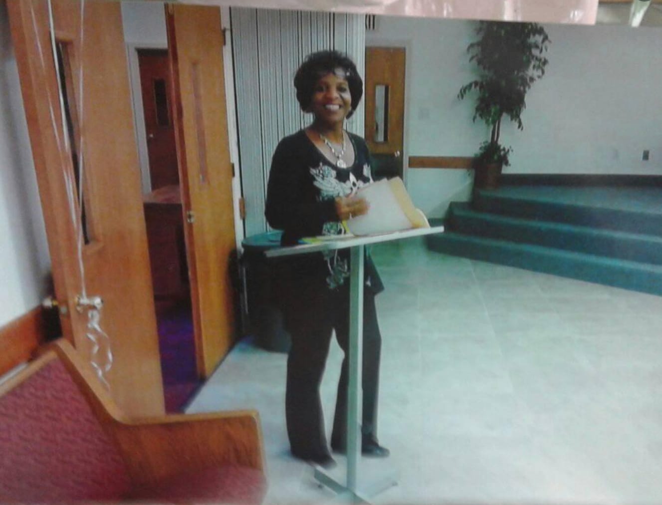 Sheila Smith speaking at a podium at a community event