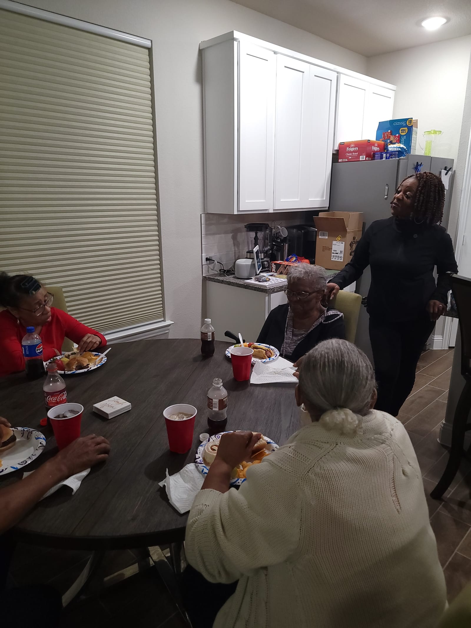 Seniors sharing a meal around a dining table
