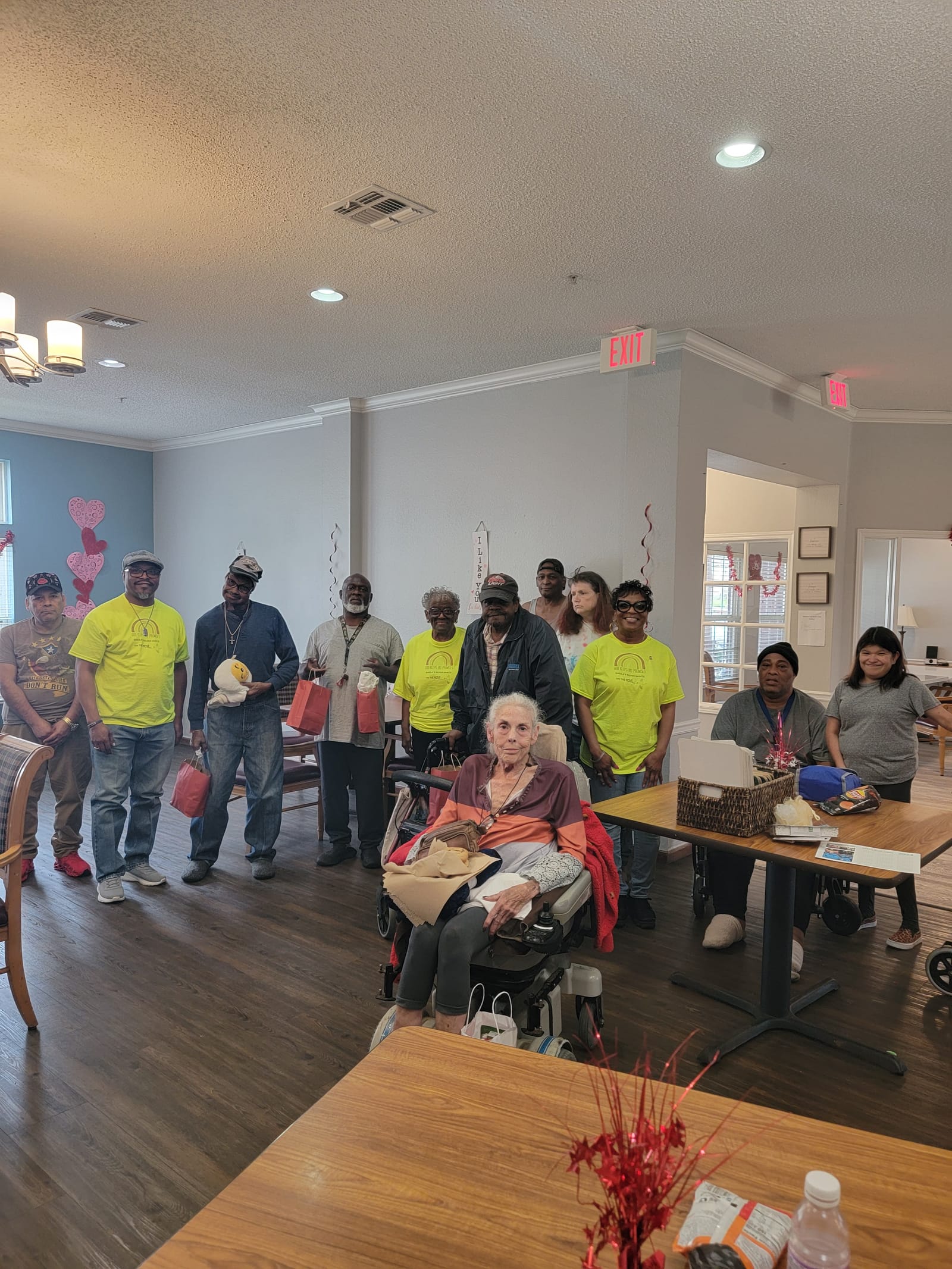 A group photo of seniors and volunteers at the end of an event
