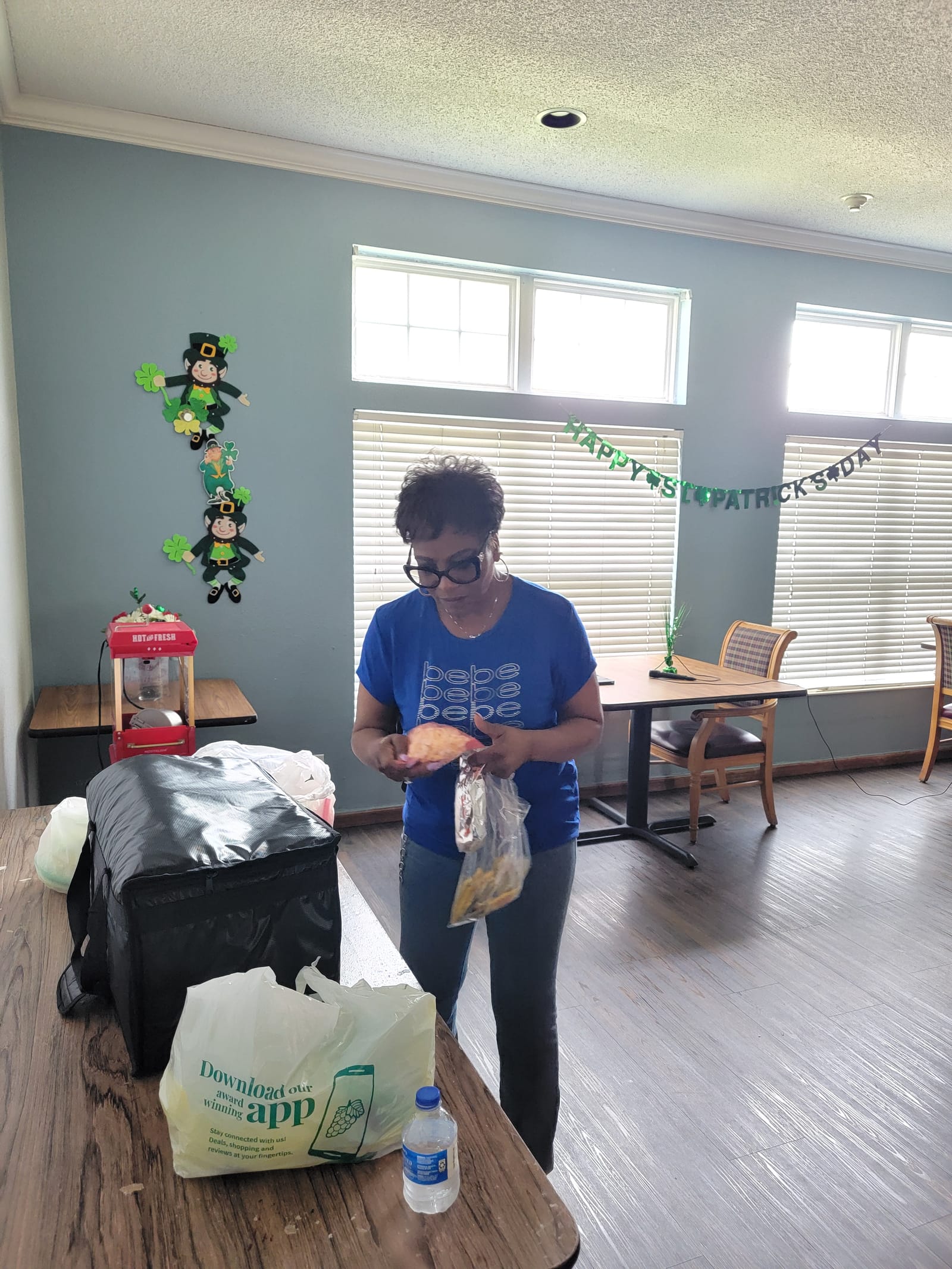 A volunteer packing up prizes after an event