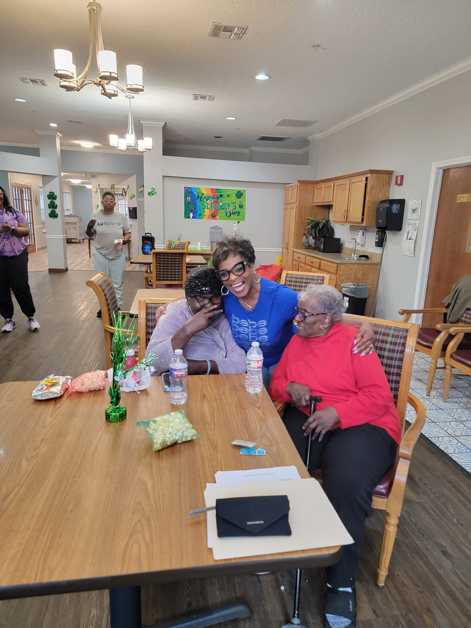 Seniors chatting at tables decorated for the holidays