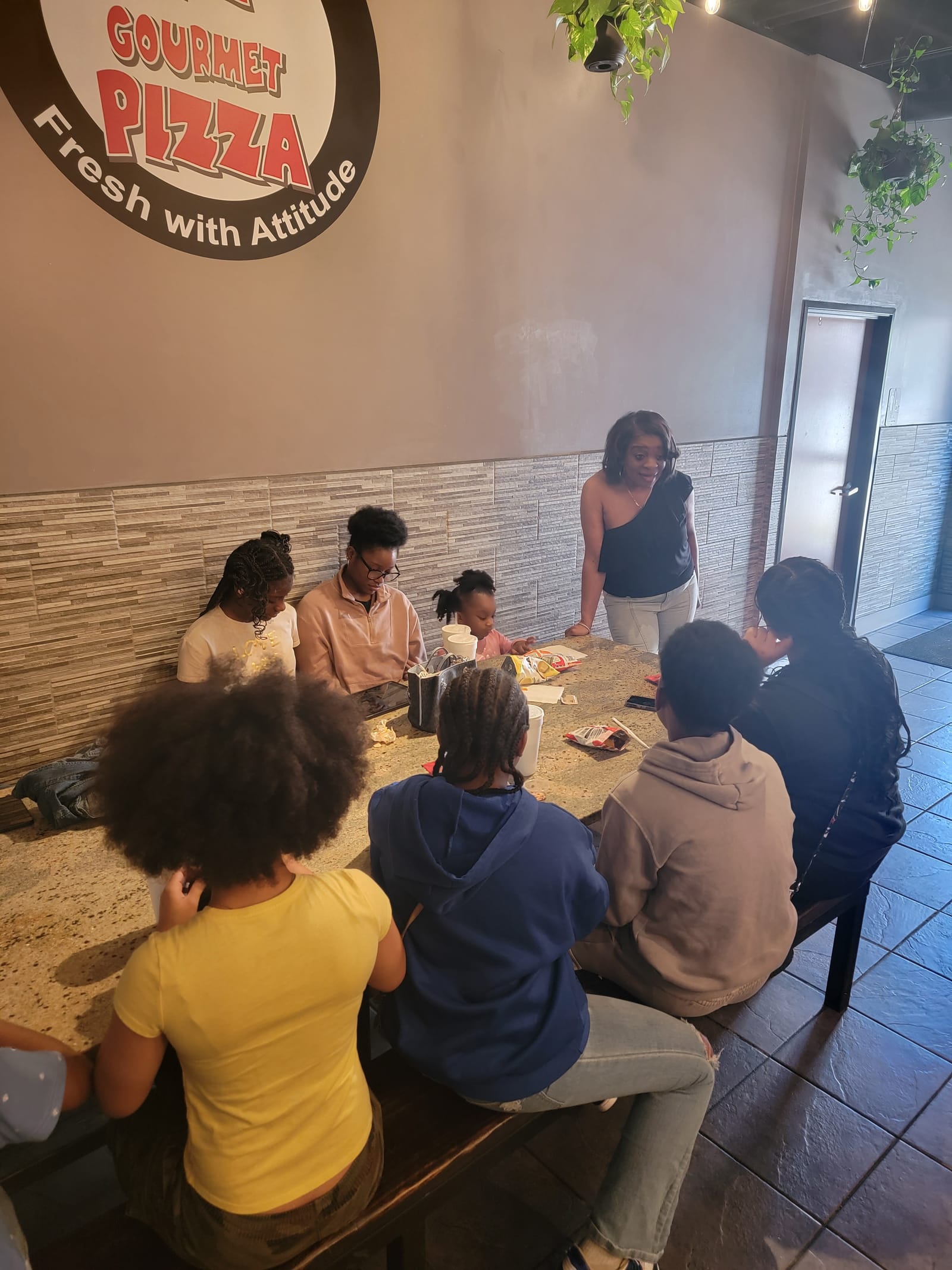 Seniors sharing a pizza lunch together